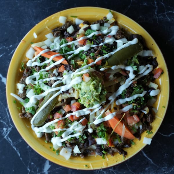 El Fuego Mexican Grill's loaded nachos with steak, black beans, pico de gallo, guacamole, and sour cream.